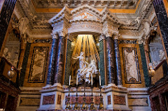 Bernini. Italian. Ecstasy of St. Theresa, 1645—52. (Cornaro Chapel, Santa Maria della Vittorio) Baroque. -commisisoned for a family burial statue -Bernini is great architect, sculpture, a truple threat -Bernini includes sculptures of the familes -balconies, onserve primary images that are representions of the Ecstacy of St Theresa Broken pediment on classical corinthian columns -altar -balistrade by which the chapel is protected -design the bronze rays of light htan come in behind him, window puts light on the ecstatic vision St Theresa has