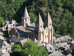 Church of Sainte-Foy Conques, France. Romanesque Europe. Church: c. 1050-1130 C.E.; Reliuary of Saint Foy: ninth century C.E.; with later additions. Stone (architecture); stone and paint (tympanum); gold, silver, gemstone, and enamel over wood (reliquary) One can see some of the most fabulous golden religious objects in France, including the very famous gold and jewel-encrusted reliquary statue of St. Foy. The Church of Saint Foy at Conques provides an excellent example of Romanesque art and architecture