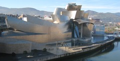 Guggenheim Museum Bilbao Spain. Frank Gehry (architect). 1997 C.E. Titanium, glass, and limestone. A museum to challenge assumptions about art museum collecting and programming with its inventive design. To showcase great fine art exhibitions and further the redevelopment of the city Bilbao.