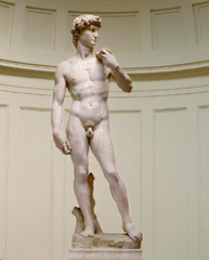 Michelangelo, Italian. David, 1501--04. High Renaissance. -David was a civic symbol of the Florentine republic, ld to the Florence Cathedral building committee to invite Michelangelo to work a great block of marble left from an earlier aborted commission into another statue of David -was symbol, just as David had protected his people and governed them justly,whoever would rule Florence would do the same -Despite the traditional association of David with heroism, Michelangelo chose to represent the young biblical warrior not after his victory, with Golaith's head at his feet, but turning his head to the left -his rugged hands sturdy body shows his strength, attention to an idealized human anatomy -modeled after classical nudes, he greatly admired Greco-Roman statues, heroic rendering of the human physique. -poised and tranquil, still evoking the historical psychological insight and internal emotionalism of Hellenistic statues --so different than Donatello's, instead of completed battle, he shows the emotionally connected presence of something unseen, ichelangel liked to depict towering pent-up emotion -this sculpture led to many papal commissions