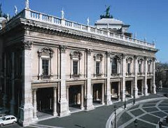 Museo Capitolino by Michelangelo, High Ren 
- Facade, Albertian plasters continuous - ground: plasters separated by deep voids, softened w/lintel-caarrying columns
- sculpture sits on top
- pediment in upper central level, marks central entrance 
- colonnettes around central level, broken tympanums
- medallions in each one of them