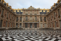 The Palace of Versailles Versailles, France. Loius Le Vau and Jules Hardouin-Mansart (architects). Begun 1669 C.E. Masonry, stone, wood, iron, and gold leaf (architecture); marble and bronze (sculpture); gardens The gigantic scale of Versailles exemplifies the architectural theme of 'creation by division' - a series of simple repetitions rhythmically marked off by the repetition of the large windows - which expresses the fundamental values of Baroque art and in which the focal point of the interior, as well as of the entire building, is the king's bed. Among its celebrated architectural designs is the Hall of Mirrors, which is one of the most famous rooms in the world. The palace and its decoration stimulated a mini-renaissance of interior design, as well as decorative art, during the 17th and 18th centuries.